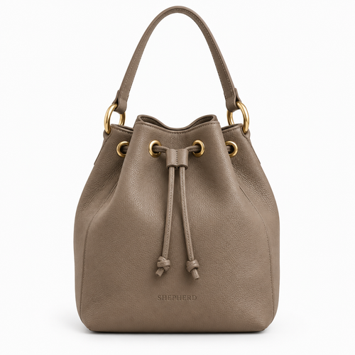 Shepherd Bucket Bag in Taupe leather with gold hardware and drawstring closure